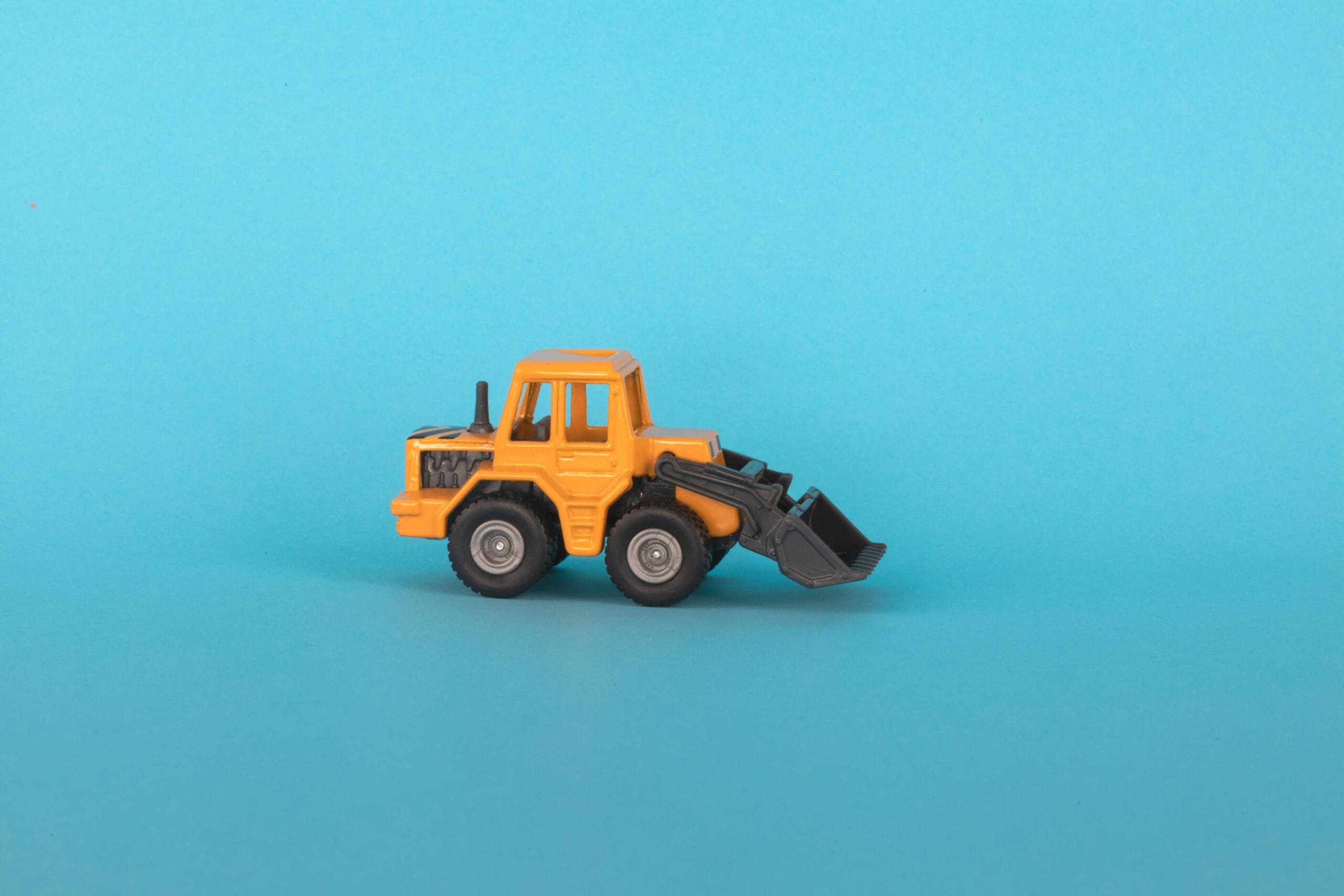 a toy truck on a blue background